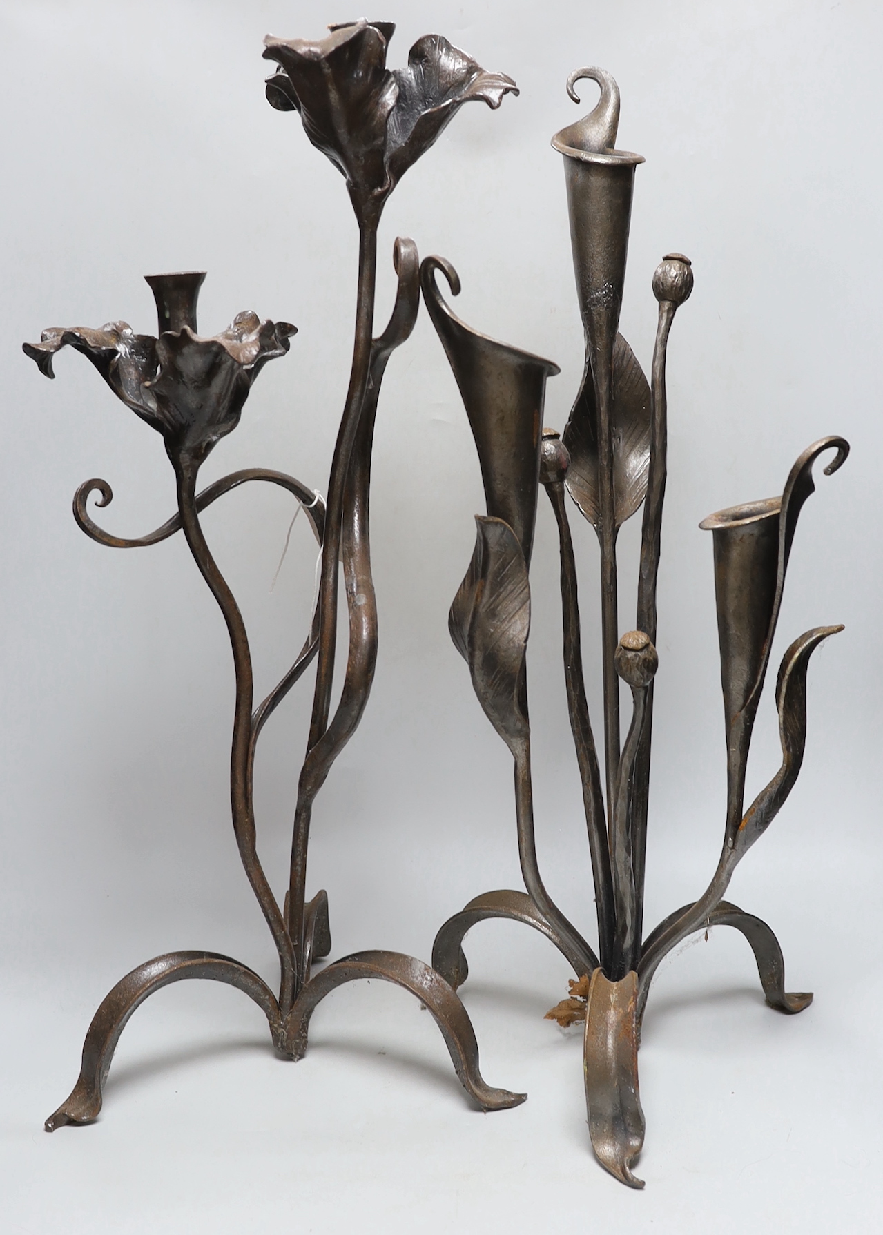 Two wrought iron floral candelabra, tallest 62cm high